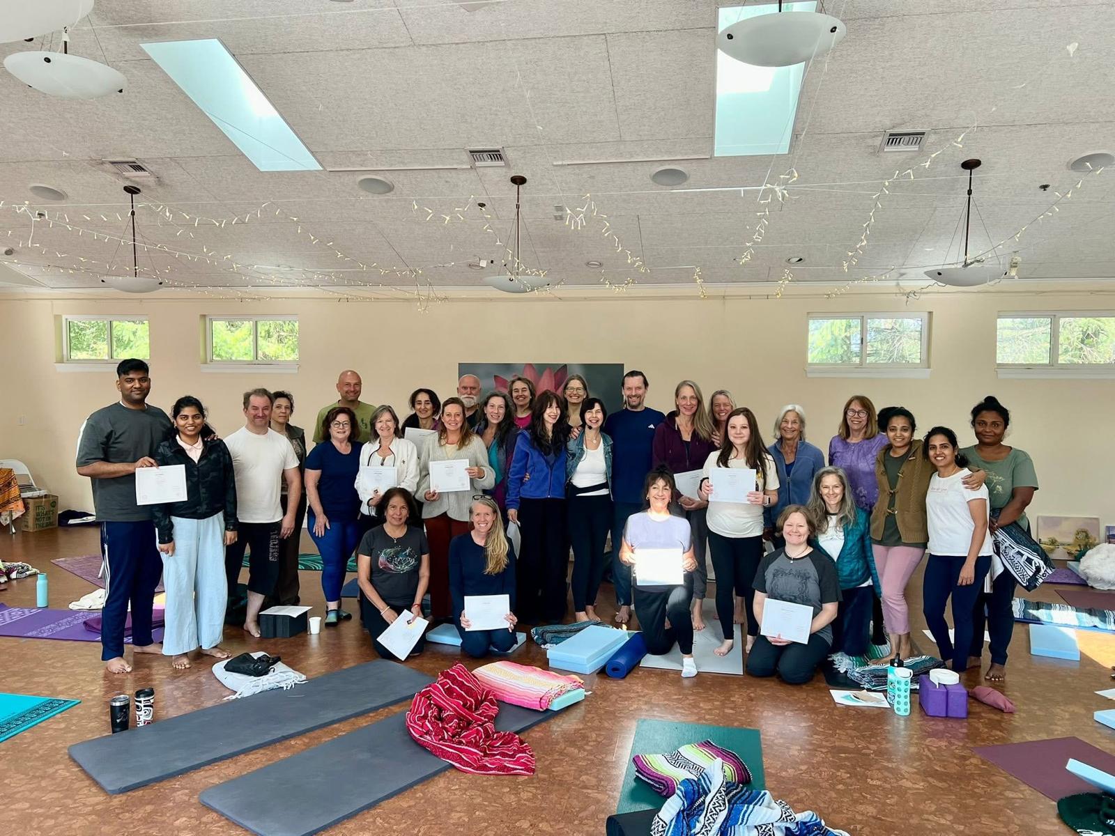 Yoga workshop participants in restorative poses