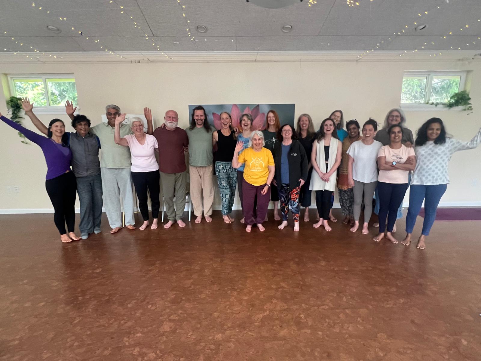 Workshop group photo in front of the lotus backdrop