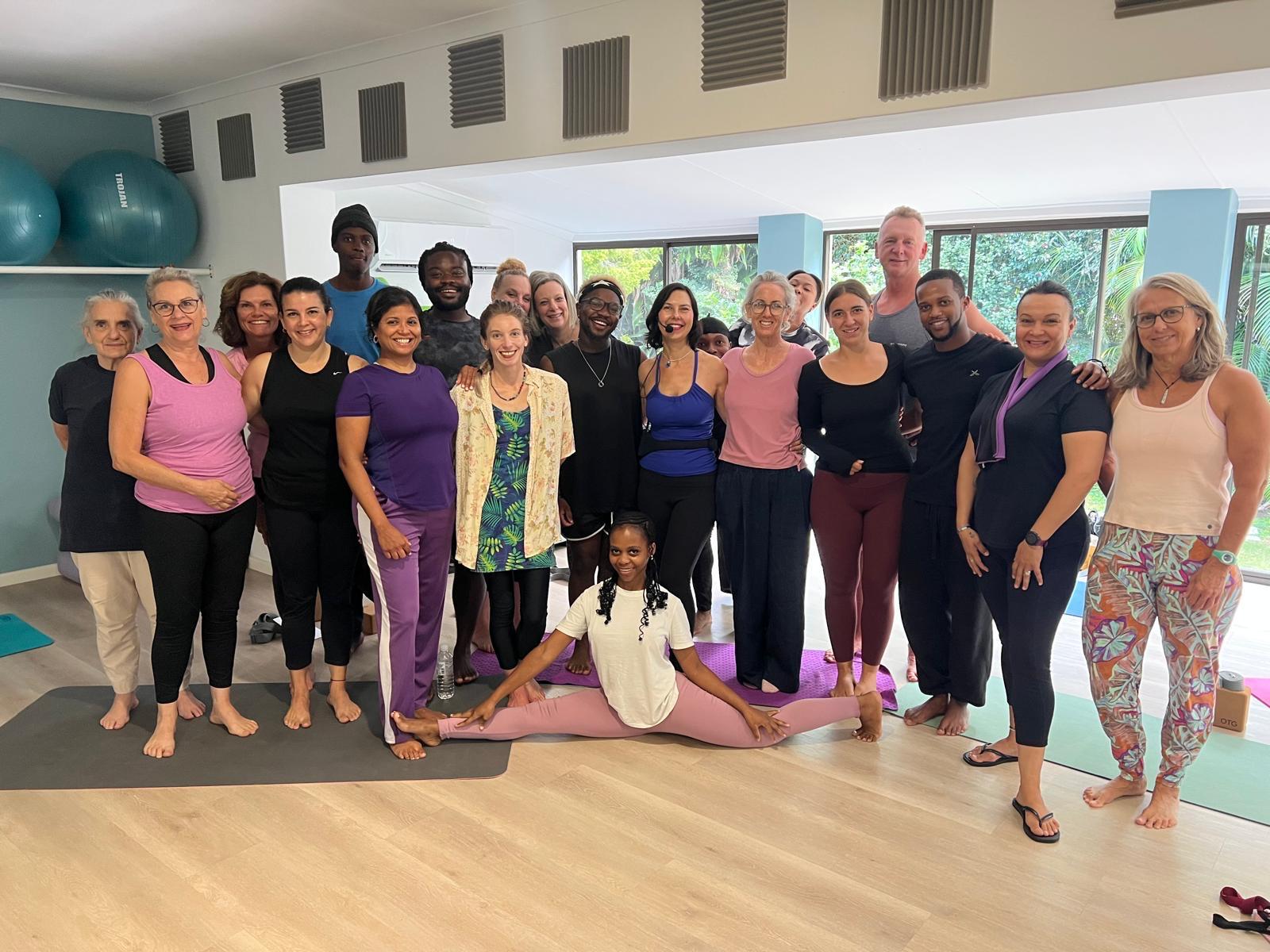 Smiling group photo after teacher training session in the studio
